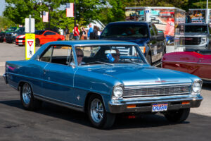 Classic blue vintage car parked at a car show.