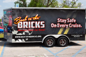Trailer with Back to the Bricks logo promoting classic car events.