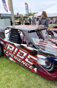 Race car with 'Ride Experience' branding and red, black design.