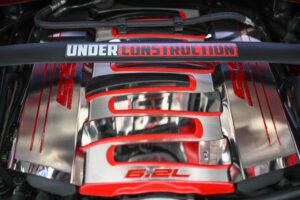 Red and black car parts with UNDERLUNDTRUCK decal.