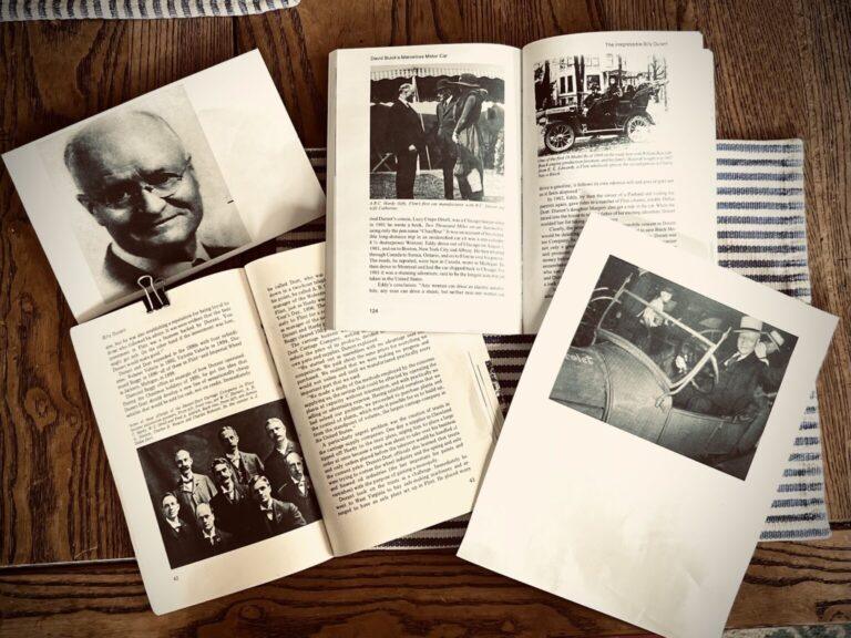 Open books with historical black-and-white photos.