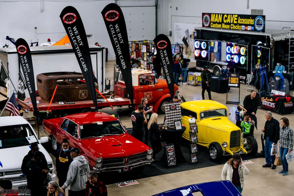 Car show with vintage vehicles and accessories.
